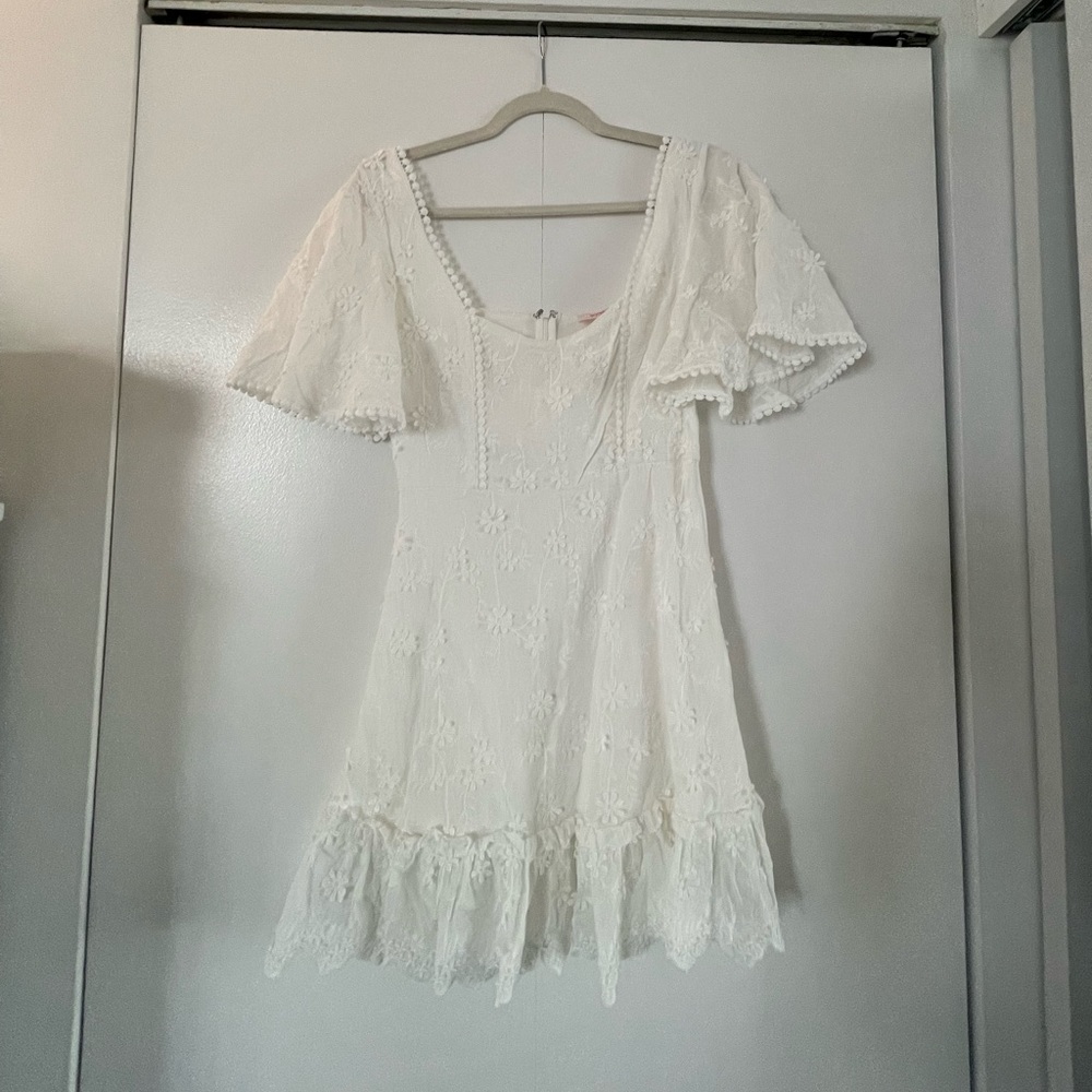 Showpo white mini dress with flutter sleeves and flower appliqué size US6